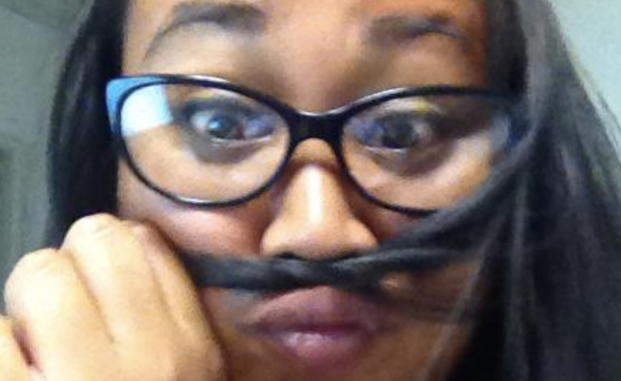 Janika with a fake mustache made from her hair